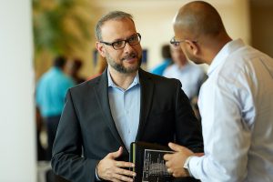 two men chatting at a job fair