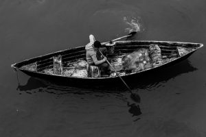 2 Men Rowing in a Boat